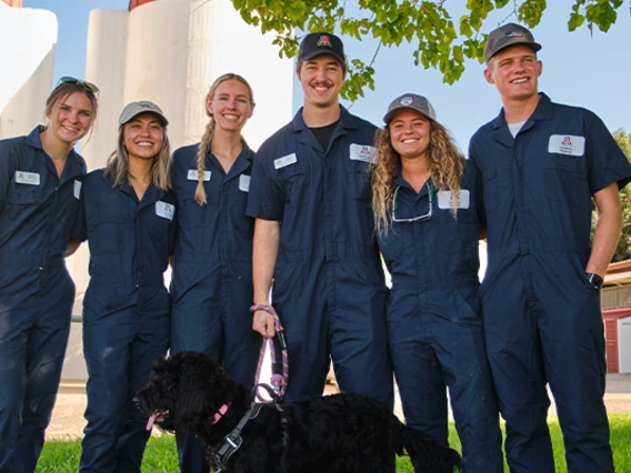 Group of students posing for photo at farm